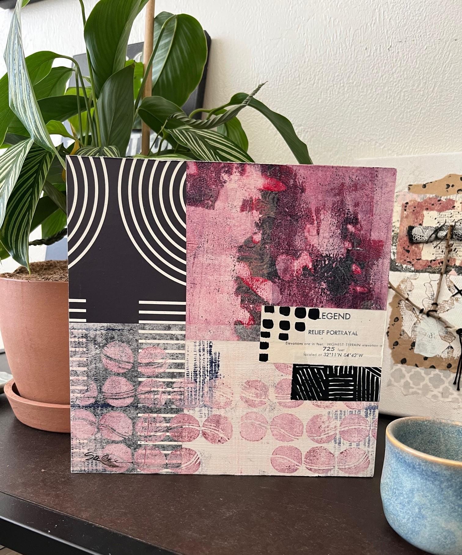 8x8 Mixed Media Collage on Birch Panel. Graphic contrast between the black and white paper with the grungy hand painted papers.