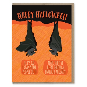 May include: Happy Halloween greeting card with two black bats hanging upside down against an orange background. The bats have speech bubbles with the text "Let's go freak some people out!" and "Nah. They've been through enough already."