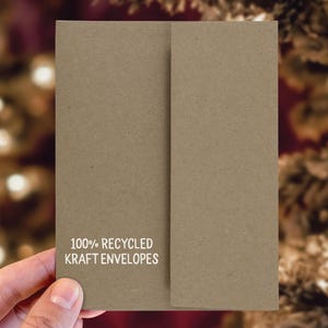 May include: A brown kraft envelope with the text "100% Recycled Kraft Envelopes" printed on the front.