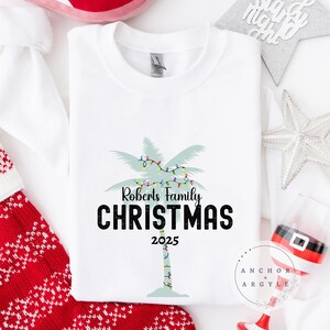 Tropical Christmas Family Name Sweatshirt Custom At the Beach Holiday Hoodie Personalized Christmas Crewneck Matching Family Vacation Shirt