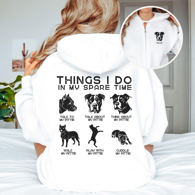 May include: White hoodie with a black graphic that says "Things I do in my spare time" and shows a pit bull dog in different poses. The text below each pose describes activities like "talk to my pittie", "walk my pittie", and "cuddle my pittie".