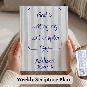 May include: A hardcover book with a blue and white striped cover. The cover features the text "God is writing my next chapter" in blue script, along with the name "Addison" and "Chapter 18". A smaller image of the book's interior is visible.