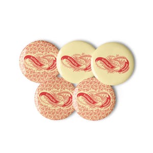 May include: Five yellow round buttons with red floral patterns and the text "Solidarity Forever" in red.