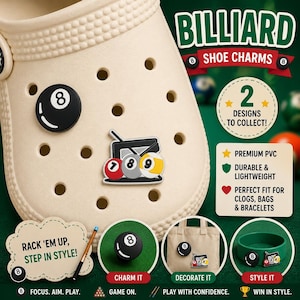 May include: Beige clog shoe with black and white billiard-themed shoe charms. The charms include an eight ball, a rack of balls, and the text "BILLIARD SHOE CHARMS". The image also includes the text "2 DESIGNS TO COLLECT!"