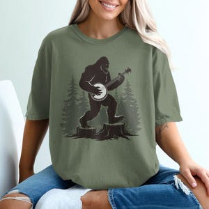 Bigfoot Playing Banjo T-Shirt: Mythical Musician Tee