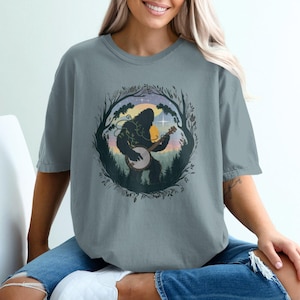 Bigfoot Banjo T-Shirt: Forest Sunset Sasquatch Art