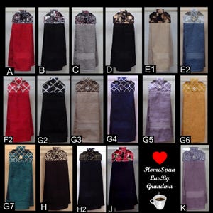 May include: A collection of hanging kitchen towels in various colors, including red, black, gray, and blue. Each towel has a decorative top with different patterns and a button closure. The image also includes the text "HomeSpun LuvBy Grandma."