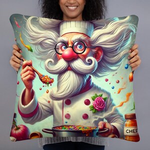 May include: A colourful illustration of a chef with a white beard and a white chef's hat, holding a spoon with colourful sweets. The chef is wearing a white chef's jacket with a pink rose on the front. The background is a light blue with colourful sweets and swirls.