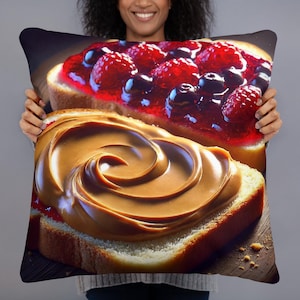 May include: A pillow with a close-up image of two slices of bread. One slice is topped with peanut butter and the other with raspberry jam.