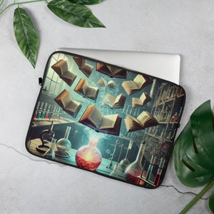 May include: A laptop sleeve with a vintage illustration of a laboratory with books flying out of a flask. The books are open and have aged pages. The laboratory has shelves with glass bottles and beakers.