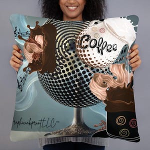 May include: A decorative cushion featuring a graphic design of a coffee cup with a swirl of cream and chocolate. The design is on a blue background with a black and white polka dot pattern. The text "Coffee" is written on the cup.