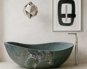 May include: A large, oval-shaped, green marble bathtub with a unique veined pattern. A silver tap stands beside the tub. A geometric pendant light hangs above, and a framed abstract artwork is on the wall.