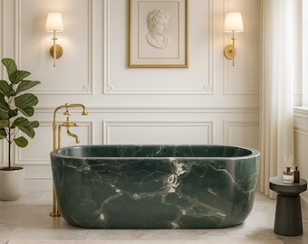 May include: An elegant bathroom featuring a dark green marble bathtub with gold taps. The room has white panelled walls, a framed picture, and wall-mounted lights. A small side table and a potted plant add to the luxurious feel.