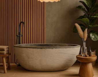 May include: A modern bathroom scene featuring a large, oval-shaped stone bathtub. The room has a wooden accent wall and a wooden side table. A decorative light fixture hangs from the ceiling, and a potted plant adds a touch of greenery.