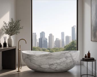 May include: A luxurious bathroom featuring a large, oval marble bathtub with a gold faucet. The room has a large window with a city skyline view, a small side table, and a decorative vase with greenery.