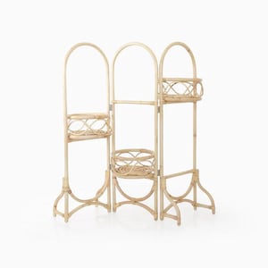 May include: A natural-toned, three-panel bamboo plant stand with arched tops and woven basket shelves. The stand has a decorative, curved base and is designed to hold plants. The overall height is approximately 60 inches.