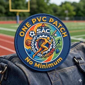 May include: A round, blue PVC patch with the text "ONE PVC PATCH" and "No Minimum". The patch features a colorful design with sports equipment and a running figure, with the text "SAC Summit Athletic Club".