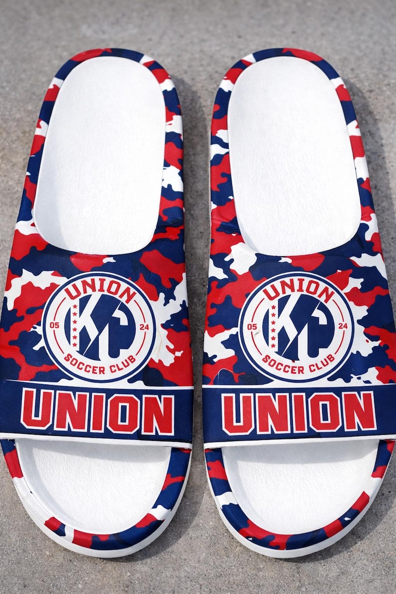 Custom team clogs featuring lightweight ergonomic design and ventilated upper for airflow and comfort. Perfect for sports merchandise, school events, or personalized footwear, these slip-on clogs provide everyday practicality with eye-catching custom graphics.