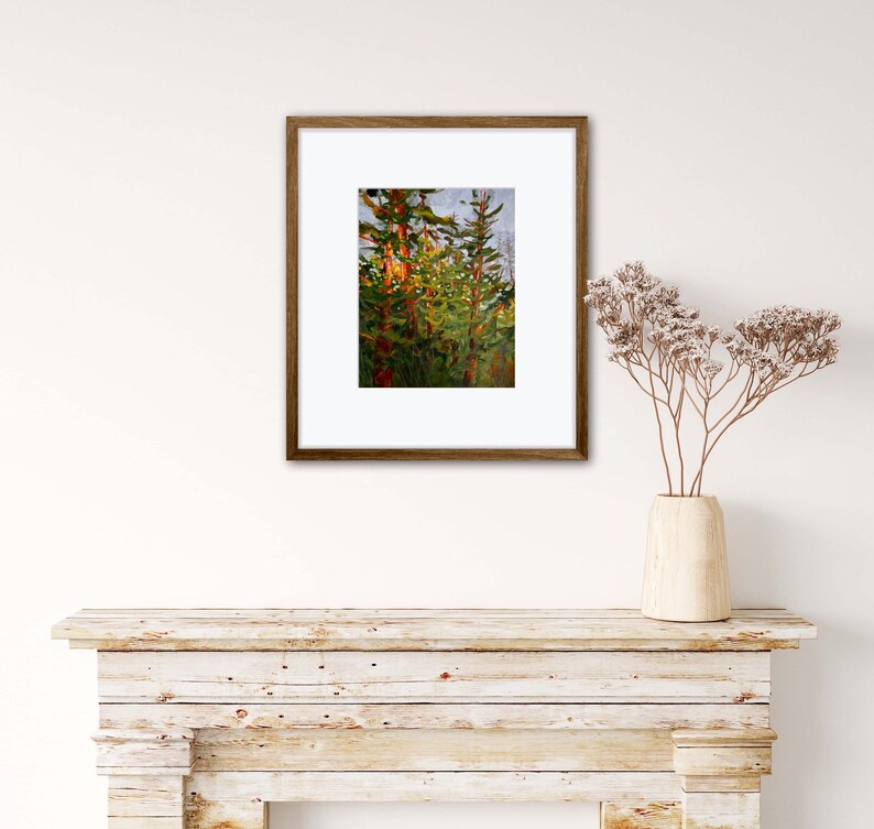 May include: A framed painting depicting a forest scene with tall, green trees. The trees are painted in a stylised, abstract manner with hints of orange and red.