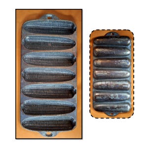 May include: Two cast iron corn stick pans. One pan has seven corn cob molds, the other has eight. Both pans are dark gray and have a rustic, vintage appearance. The pans are set against a light brown background.
