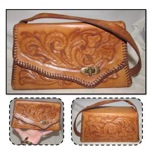 Bolso de mano vintage de piel repujada con asa superior y solapa asimétrica