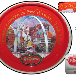 May include: Red metal tray with a white rim and a colorful illustration of the St. Louis Arch, a steamboat, and the city skyline. The text "International Exposition for Food Processors ~ Feb. 10-13, 1980" is printed around the rim. The text "St. Louis Gateway to the West" is printed on the bottom of the tray.