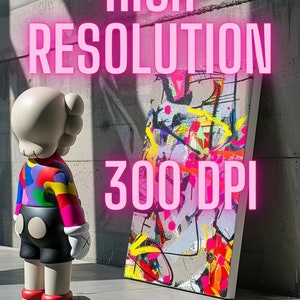 May include: A colorful abstract painting on canvas with a white frame. The painting is leaning against a gray wall. The text "HIGH RESOLUTION 300 DPI" is displayed in pink letters above the painting. A white and colorful toy figure stands in front of the painting.