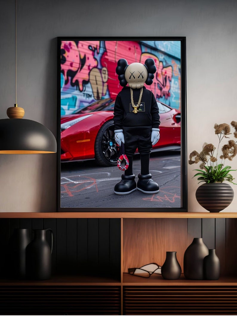 May include: A black and white illustration of a skull wearing a gold chain and a black hoodie, standing in front of a red sports car with a graffiti wall in the background.