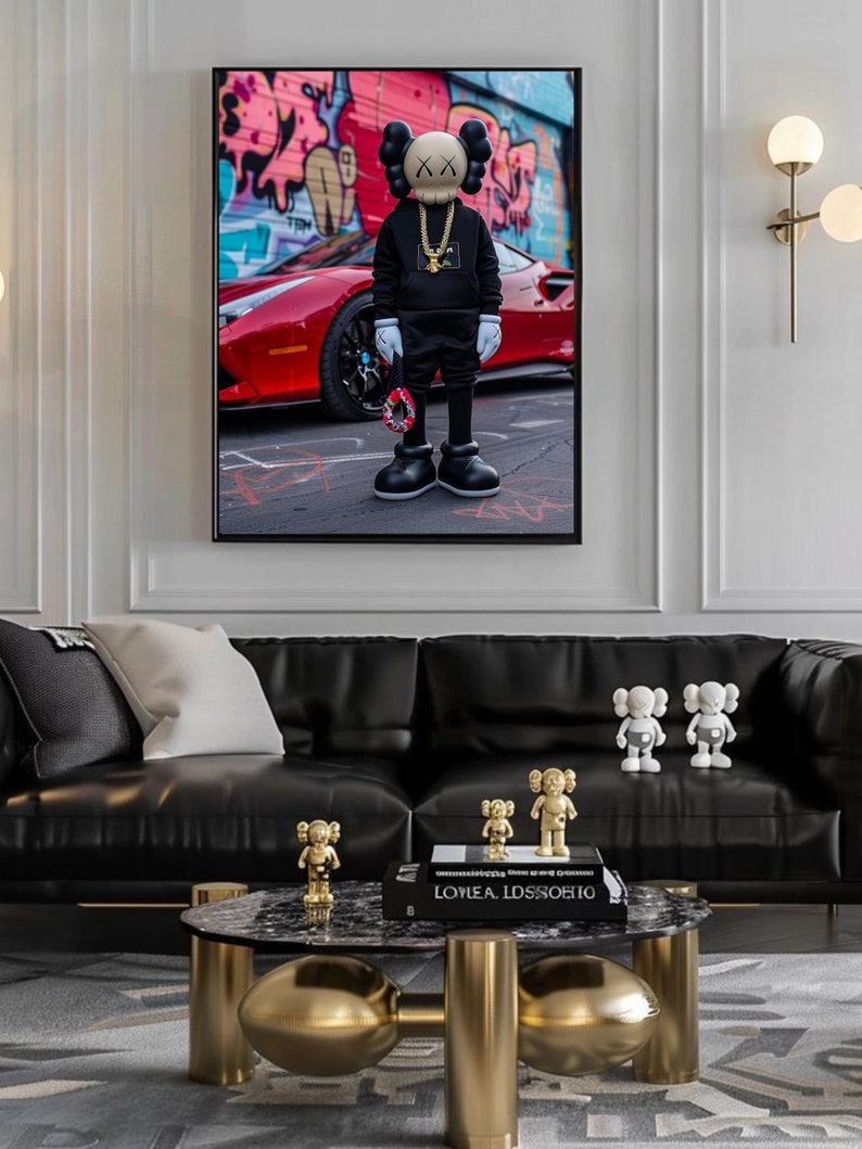 May include: A black and white figurine of a cartoon character standing in front of a red sports car. The character is wearing a black sweatshirt, black pants, and a gold chain. The car is parked in front of a graffiti wall. The figurine is surrounded by smaller gold and white figurines.