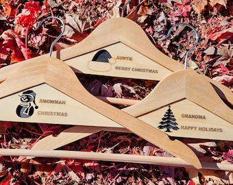 Personalized Holiday Clothes Hangers: Engraved a message with a Silhouette Image