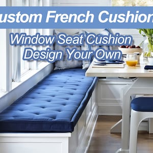 May include: A blue window seat cushion with button tufting. The cushion is in a white window seat with a white trim. The text "Window Seat Cushion Design Your Own" is on the image.