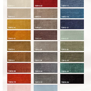 May include: A color palette chart displaying various fabric swatches in a grid layout. Each rectangular swatch features a unique color and a corresponding alphanumeric code, such as T2012-16 or T2012-34. The text Chenille Palette is printed at the bottom.
