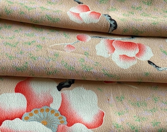 Vintage silk cherry blossoms on cream colored background