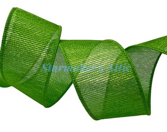 May include: A green metallic ribbon with a textured, woven design. The ribbon is shiny and has a slight shimmer.