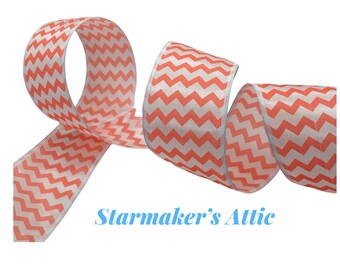 May include: A roll of coral and white chevron patterned ribbon. The ribbon is satin and has a wired edge.