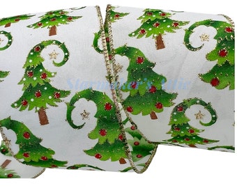 May include: White ribbon with a green and red Christmas tree pattern. The trees have gold glitter accents and are on a white background. The ribbon has a gold wired edge.