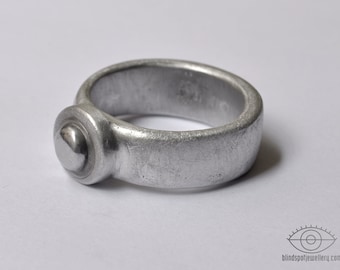 Aluminum ring with iron cabochon