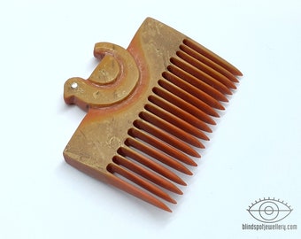 Carved plastic comb