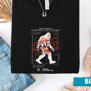 Cryptid Hunter Gift, Redacted Bigfoot Shirt, Top Secret Sasquatch Graphic Shirt, Confidential Urban Legend Shirt, Retro Sci-Fi Top