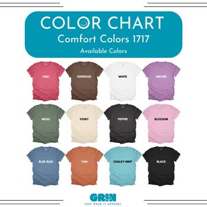 May include: Color chart of Comfort Colors 1717 t-shirts. The available colors are: Chili, Espresso, White, Orchid, Moss, Ivory, Pepper, Blossom, Blue Jean, Yam, Chalky Mint, and Black. The brand name is Grin and Wear It Apparel.