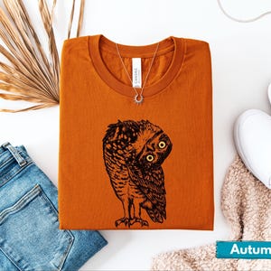 May include: A weathered wooden sign, inscribed with "Welcome to our home" in a handwritten font. The sign has a distressed appearance, ideal for a front door or hallway, and evokes a sense of warmth.