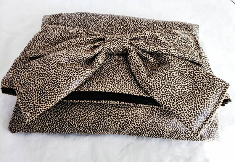 black and cream clutch bag