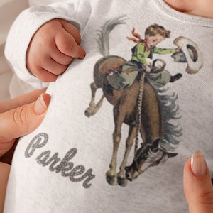 Organic Onesie™ Custom Name Retro Western One Piece Bodysuit with Buckaroo Cowboy on Horse. Cute Southwestern or Western themed baby Onesie™ image 1