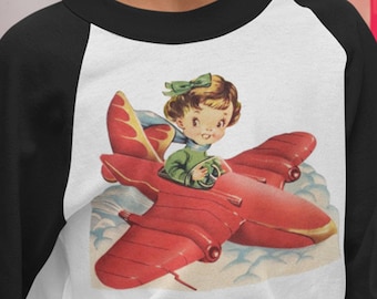 Retro Pilot Girl Airplane Shirt. Retro Raglan Shirt. Girl Pilot in Red Plane. Vintage Graphic T Shirt. Choose size 3 months to 12 years.