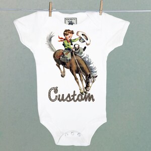 Organic Onesie™ Custom Name Retro Western One Piece Bodysuit with Buckaroo Cowboy on Horse. Cute Southwestern or Western themed baby Onesie™ white short sleeve