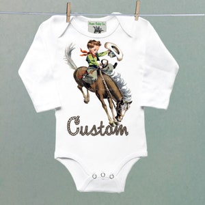 Organic Onesie™ Custom Name Retro Western One Piece Bodysuit with Buckaroo Cowboy on Horse. Cute Southwestern or Western themed baby Onesie™ white long sleeve