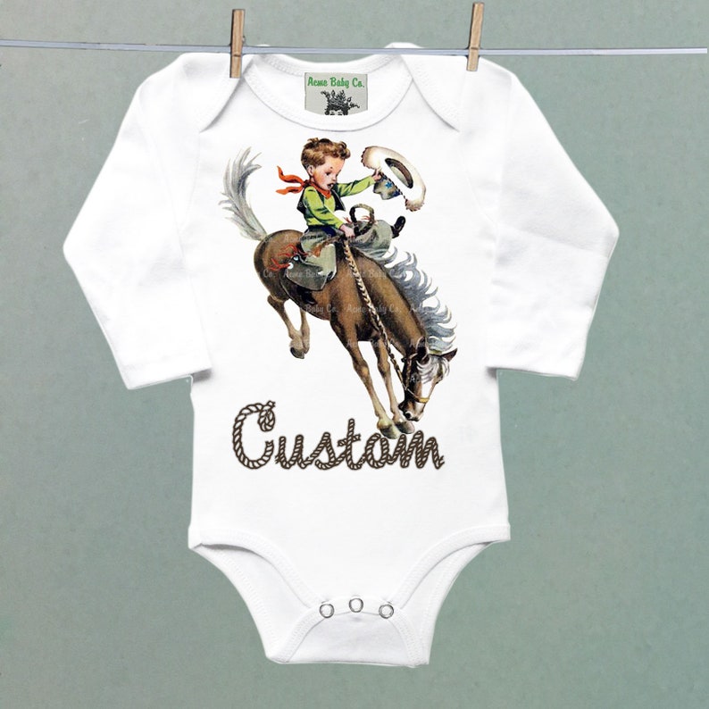 Organic Onesie™ Custom Name Retro Western One Piece Bodysuit with Buckaroo Cowboy on Horse. Cute Southwestern or Western themed baby Onesie™ white long sleeve