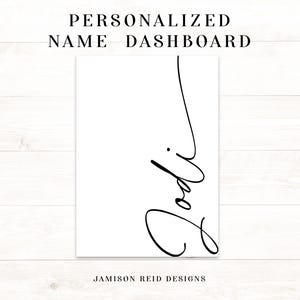 May include: A white rectangular sign with the name "Jodi" in elegant black cursive script. The text "PERSONALIZED NAME DASHBOARD" is at the top, and "JAMISON REID DESIGNS" is at the bottom.