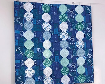 Flora  Fabric Pack -all the' Bluebell' fabric from Janet Clare's' Moda fabric collection to piece the top and bind this striking quilt .