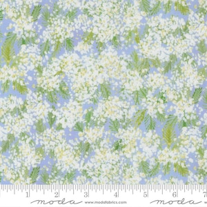 May include: Floral fabric with a light blue background and a pattern of white and yellow flowers with green leaves. The fabric has a delicate, airy feel, suitable for quilting or apparel.